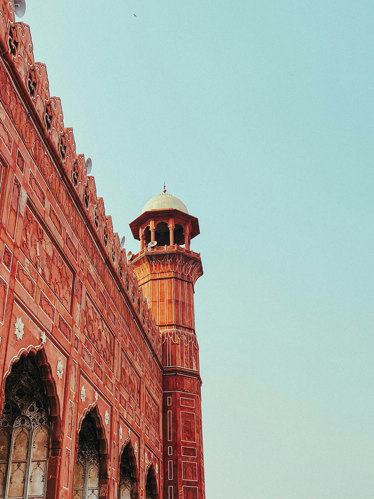 Red sandstone minaret and walls of Badshahi Mosque in Lahore